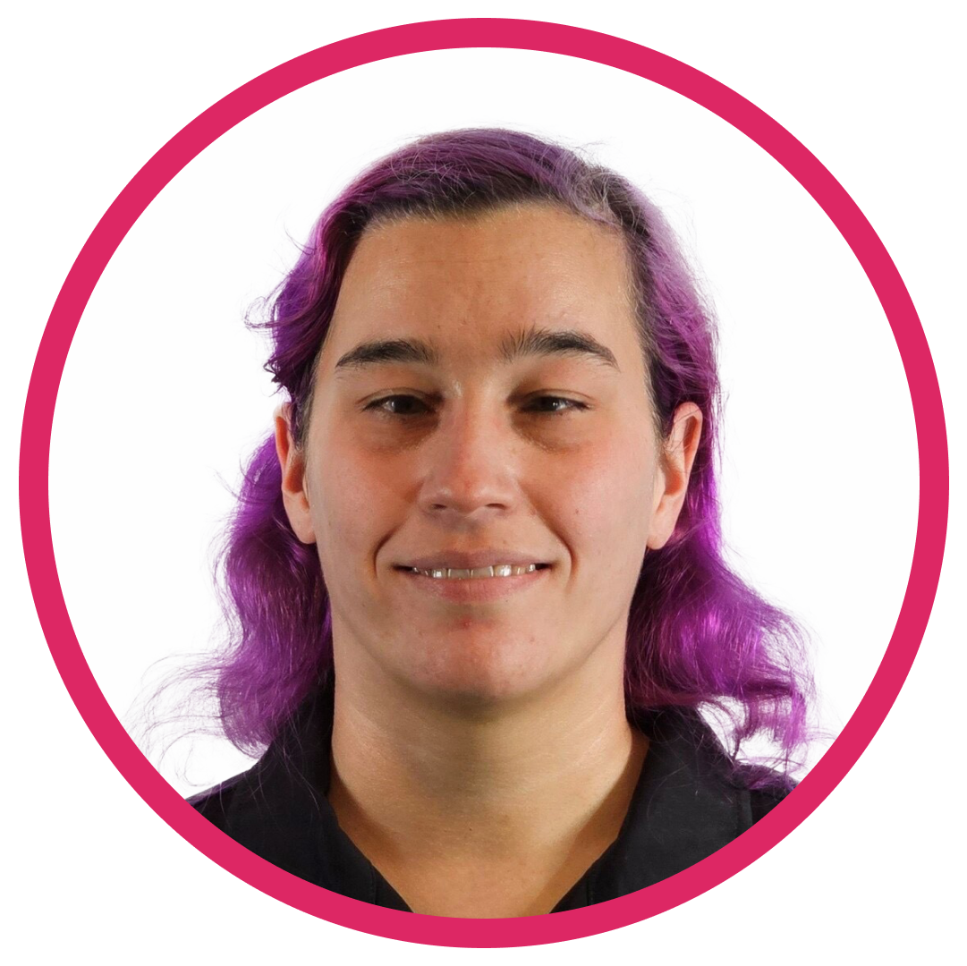 Portrait of Caitlin W. a woman with mid-length, wavy purple hair, wearing a black top, set inside a circular frame with a pink border.