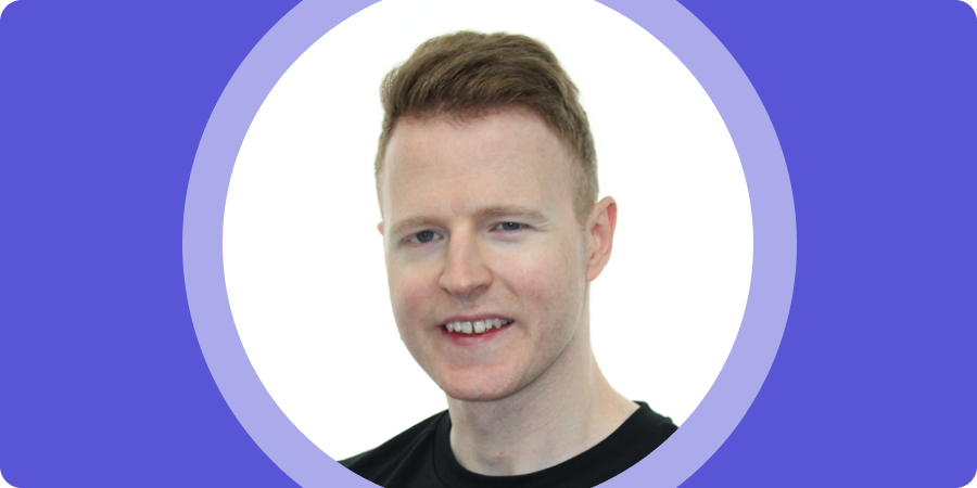 James-B-Banner-mobile Banner image. Portrait of James B, a white man with short, light brown hair, wearing a black t-shirt and smiling, set inside a purple circular frame with a purple border.