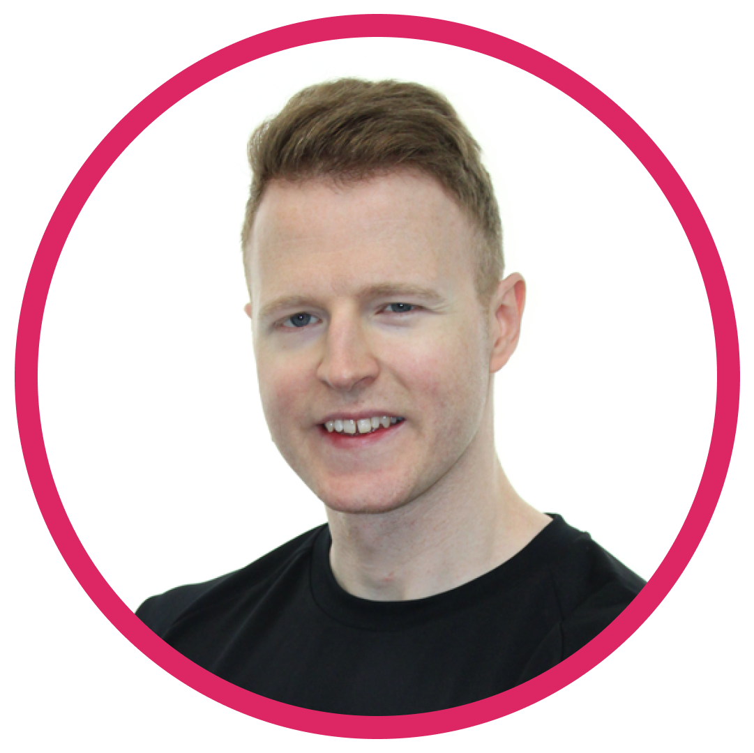 Portrait of James B, a white man with short, light brown hair, wearing a black t-shirt and smiling, set inside a circular frame with a pink border.